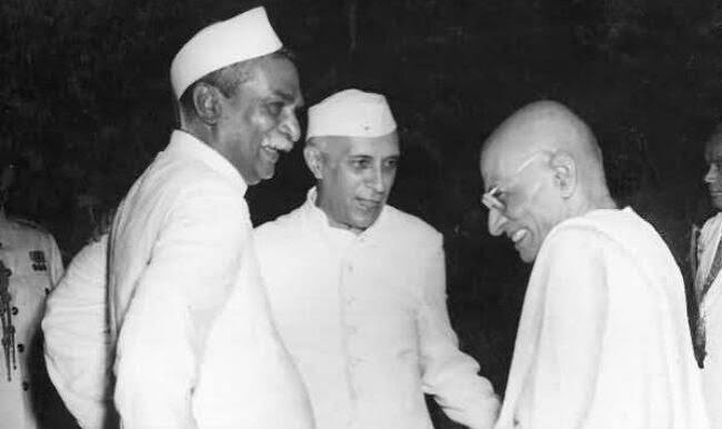 Rajendra Prasad and Jawaharlal Nehru greeting a smiling C. Rajagopalachari.
