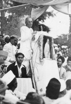 C. Rajagopalachari standing to address a large open-air public meeting in 1939.